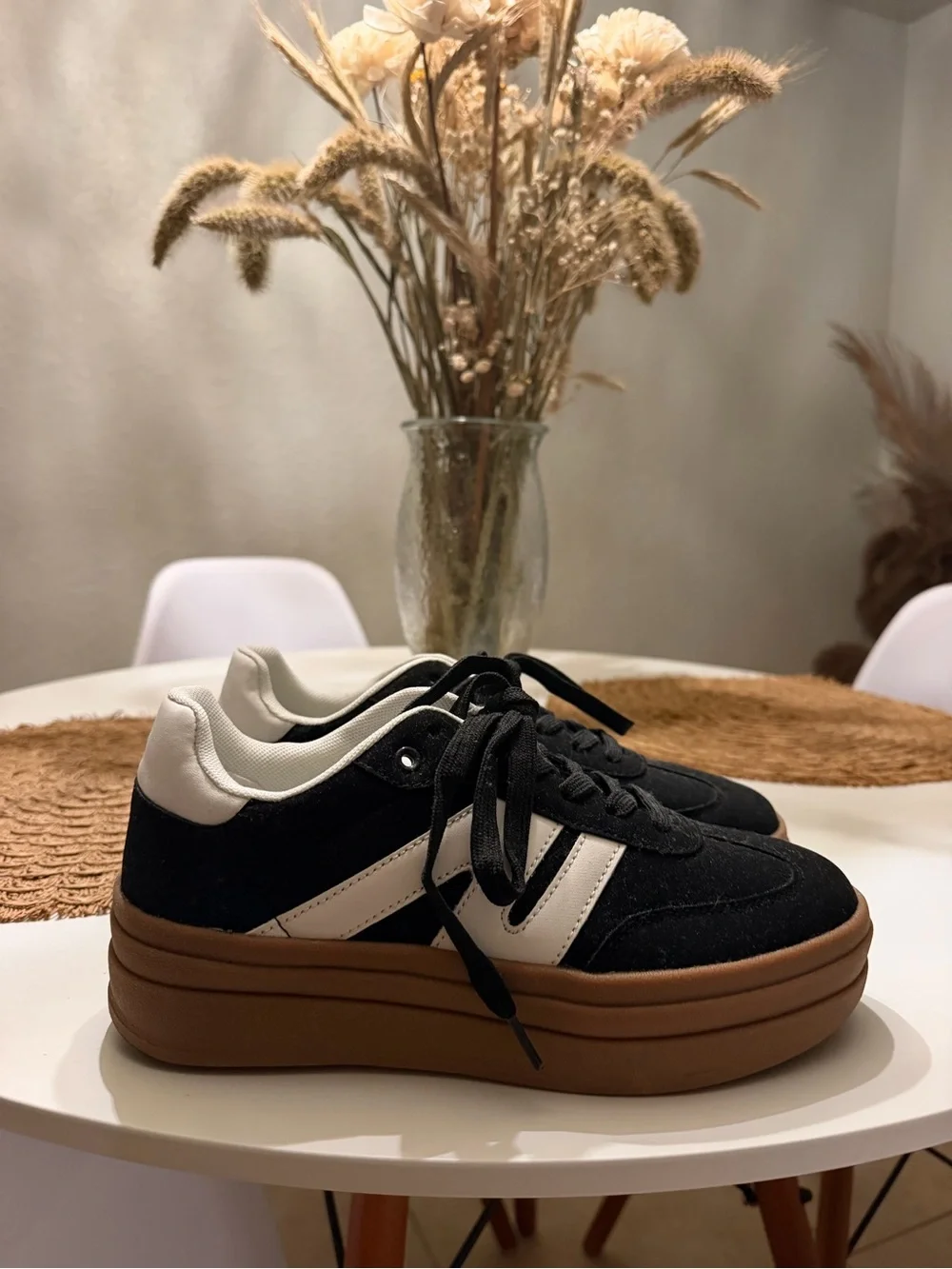 Platform Lace-Up Sneakers in Black and White.